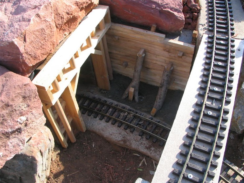 Tunnel portal with log supports